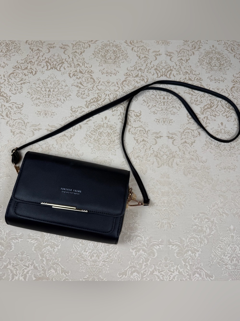 Forever Young Black Crossbody Clutch with Gold Accent, Pockets